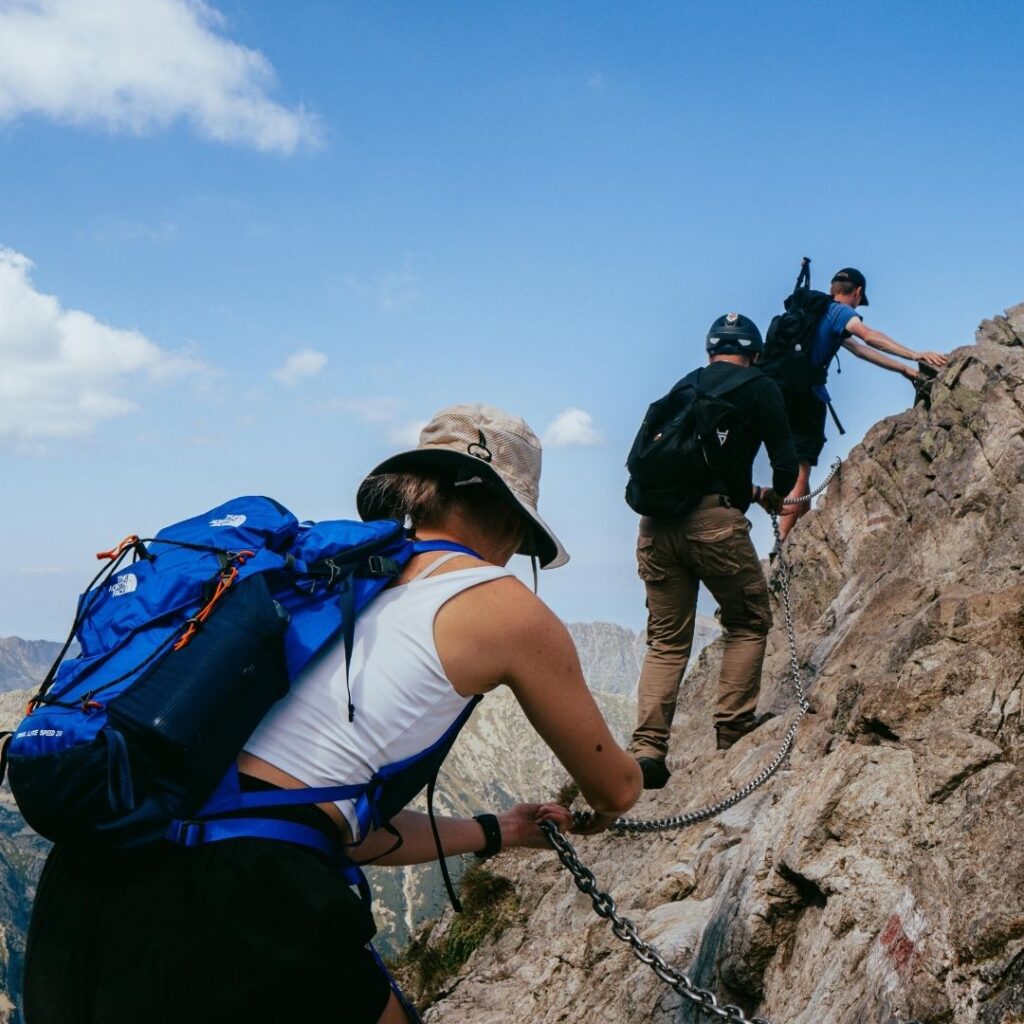 people backpacking at high altitude